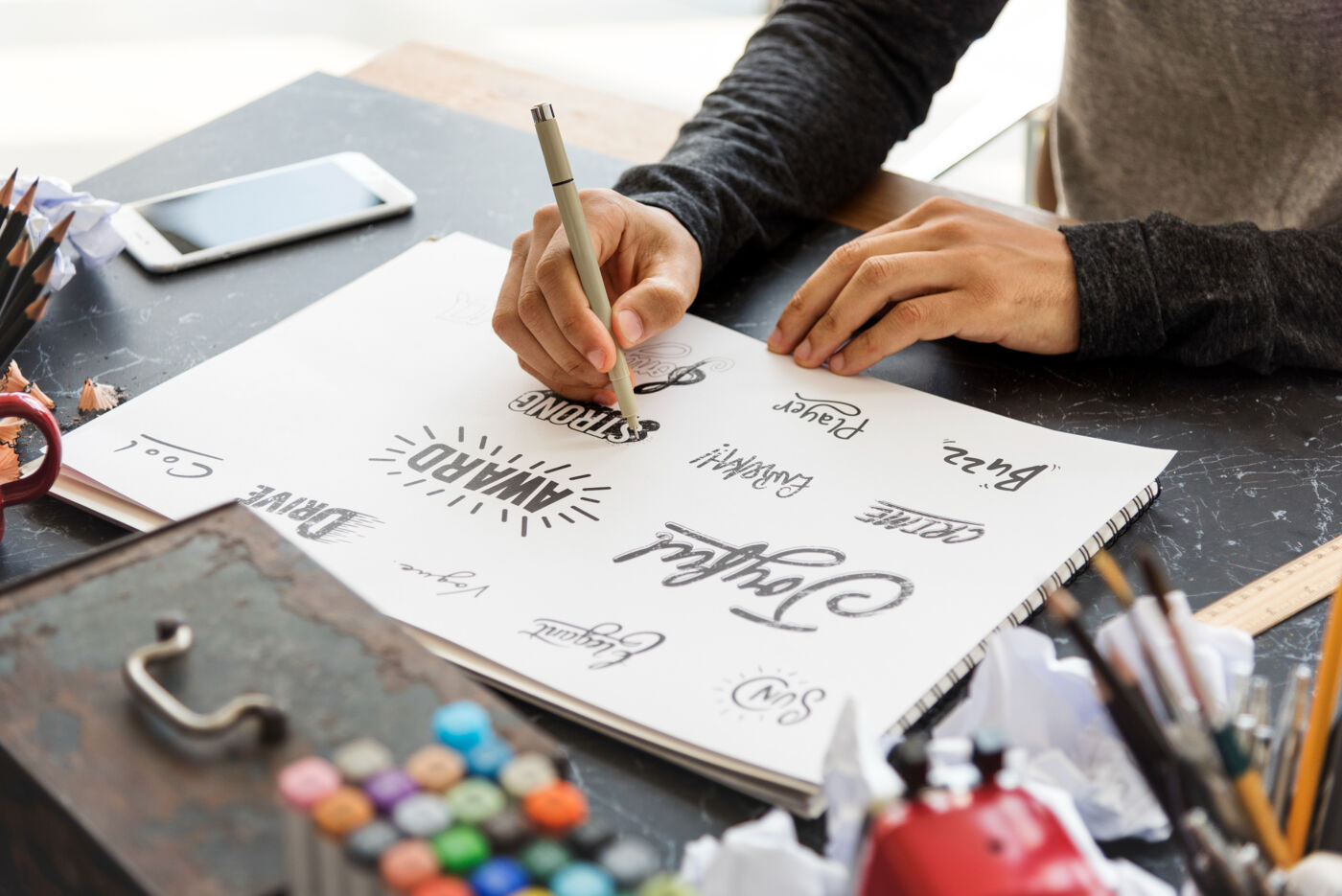 A designer's desk with a project in progress